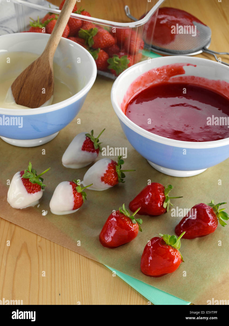 Dipping strawberries Stock Photo