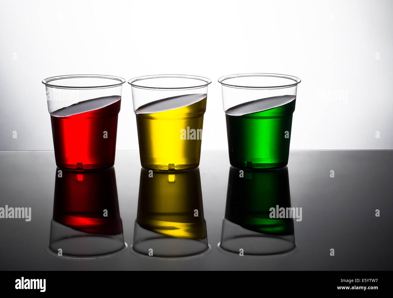Three bright drinks. If they look this skewed you shouldn't drive! Stock Photo