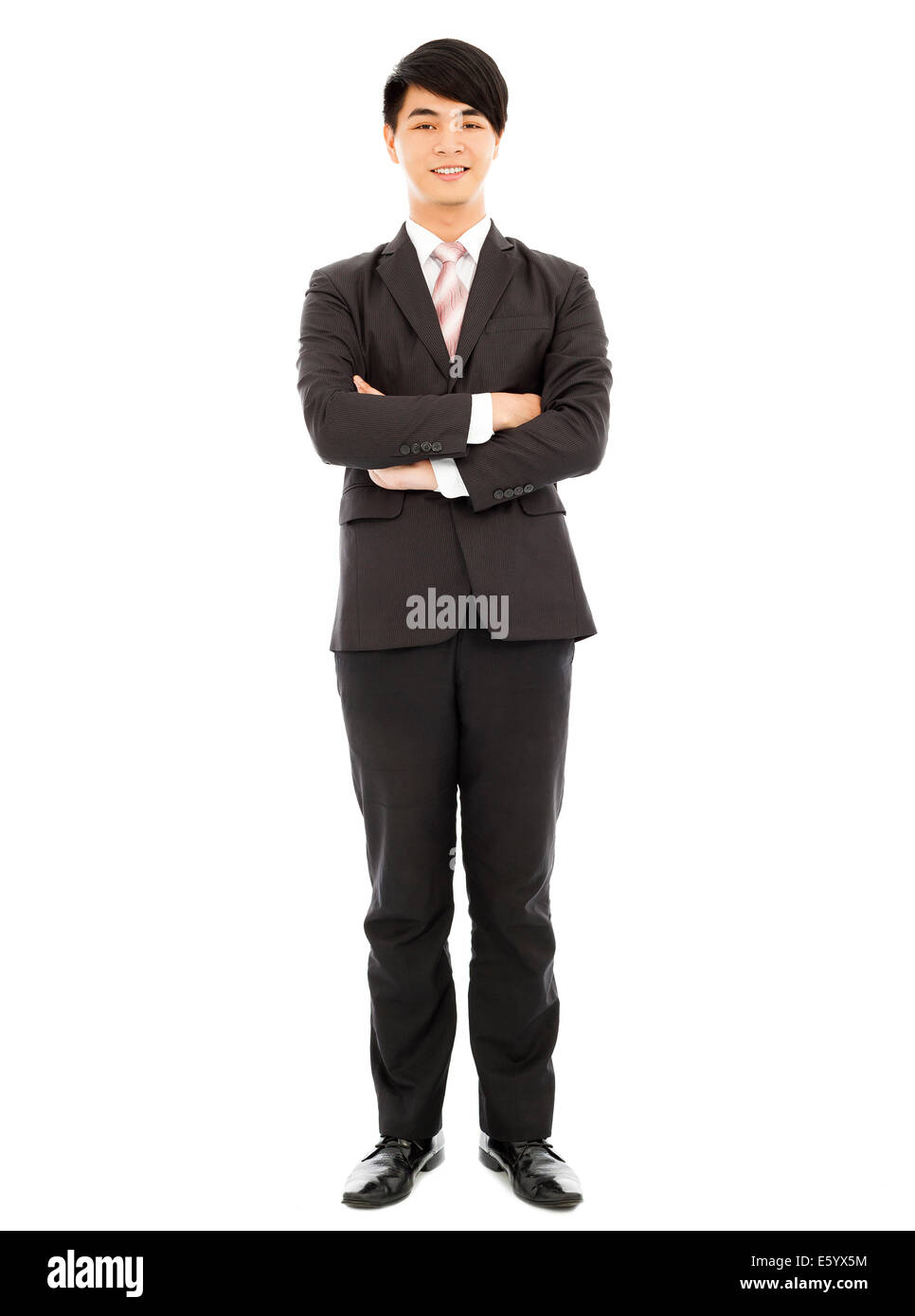 young businessman standing isolated on white background Stock Photo - Alamy