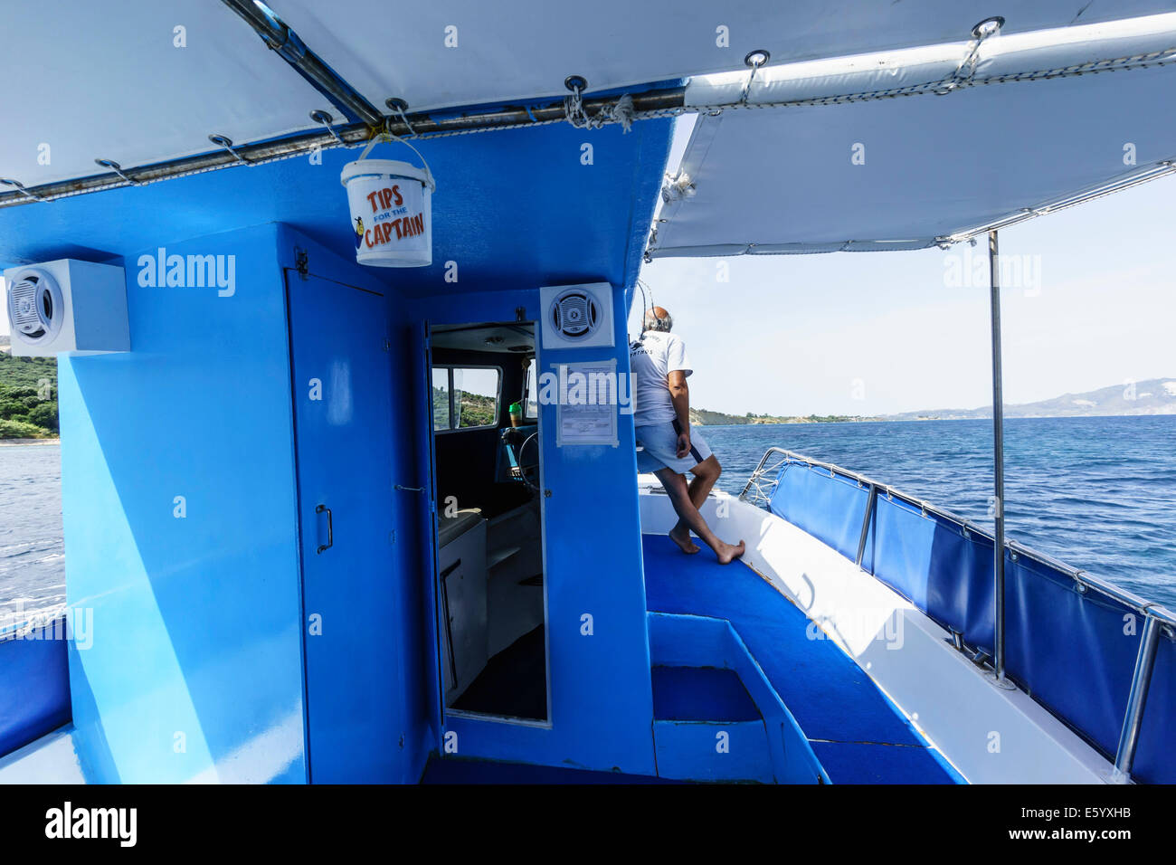 Zante, Greece - boat trip skipper in Laganas bay heading for Marathonisi  island Stock Photo - Alamy