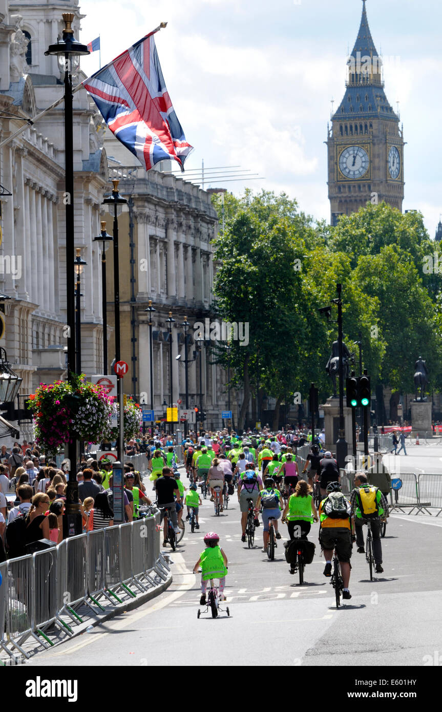London, UK. 9th August, 2014. Prudential RideLondon FreeCycle event through central London, before the afternoon's Grand Prix race for professionals. Small girl on a bike with stabilisers brings up the rear Stock Photo