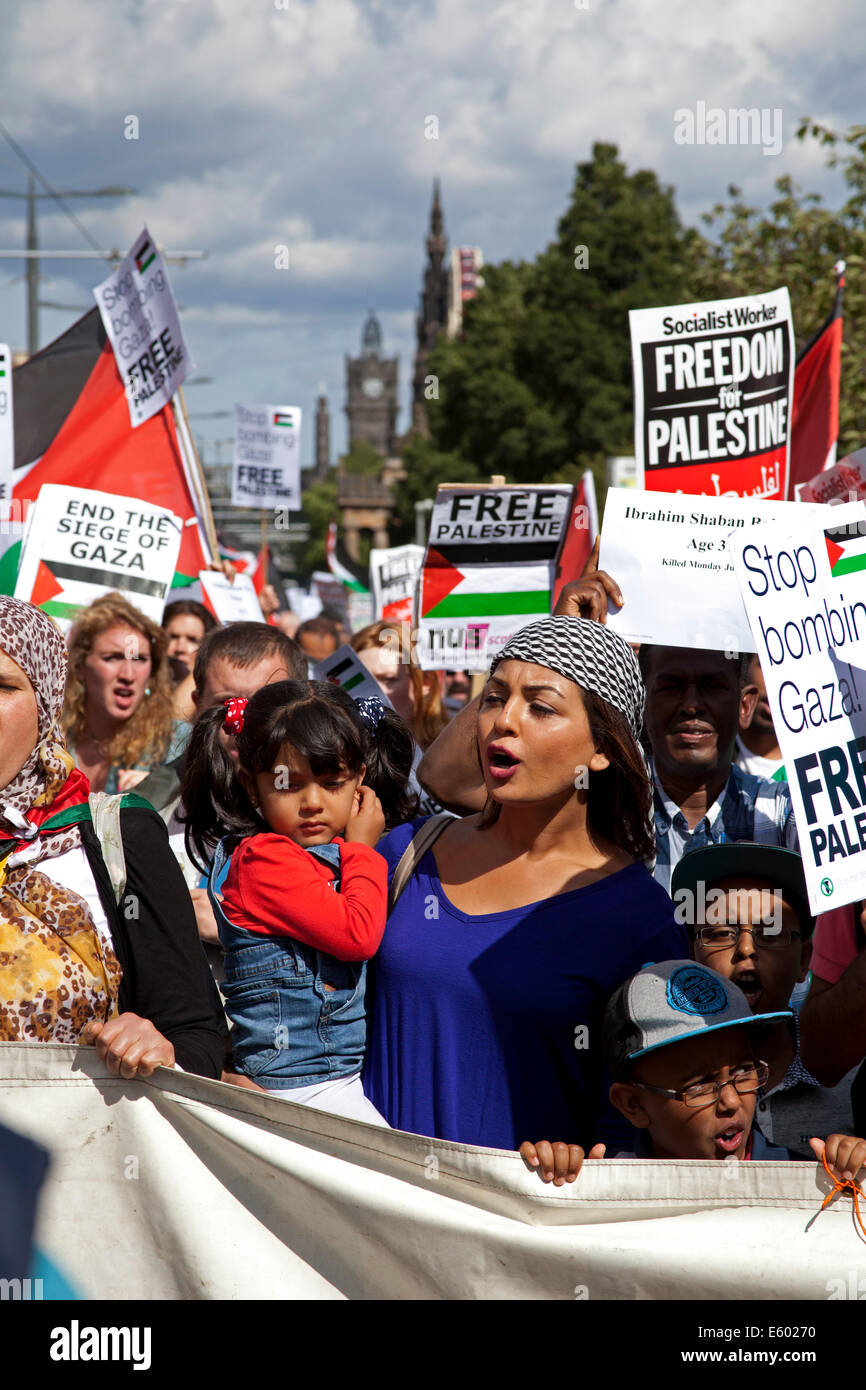 Edinburgh, Scotland, UK. 9th August, 2014. Scottish supporters of Palestinian rights took part in a rally at the Mound and march along Princes Street in Edinburgh as part of a a day of protest by the Boycott, Divestment and Sanctions (BDS) movement to highlight the situation in Gaza and in Palestine. They also had a sit down in Princes Street for two minutes silence to remember the dead. Stock Photo