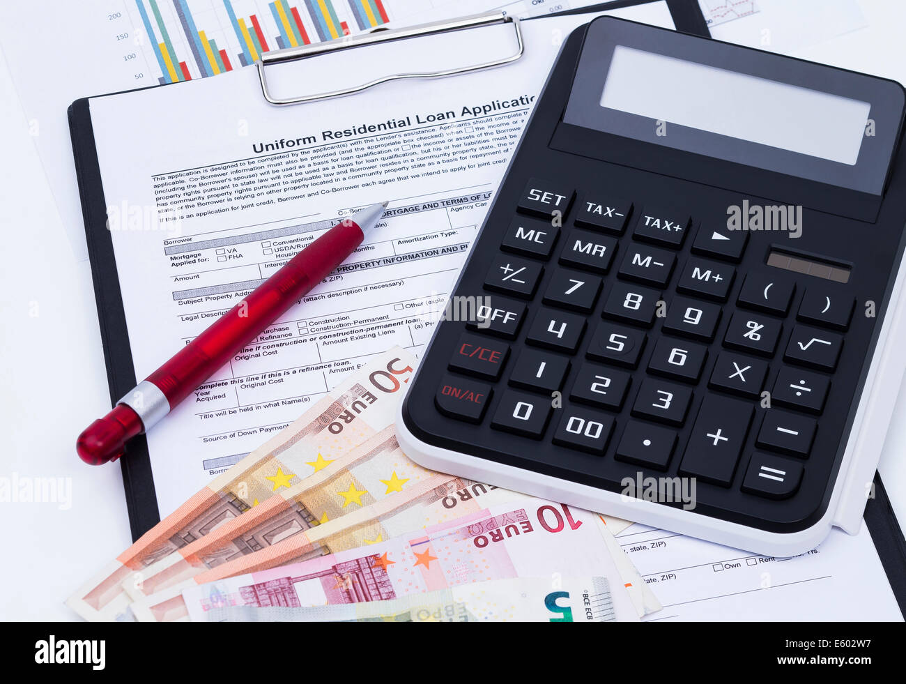 Unfilled loan application form with calculator, money, pen and notepad Stock Photo