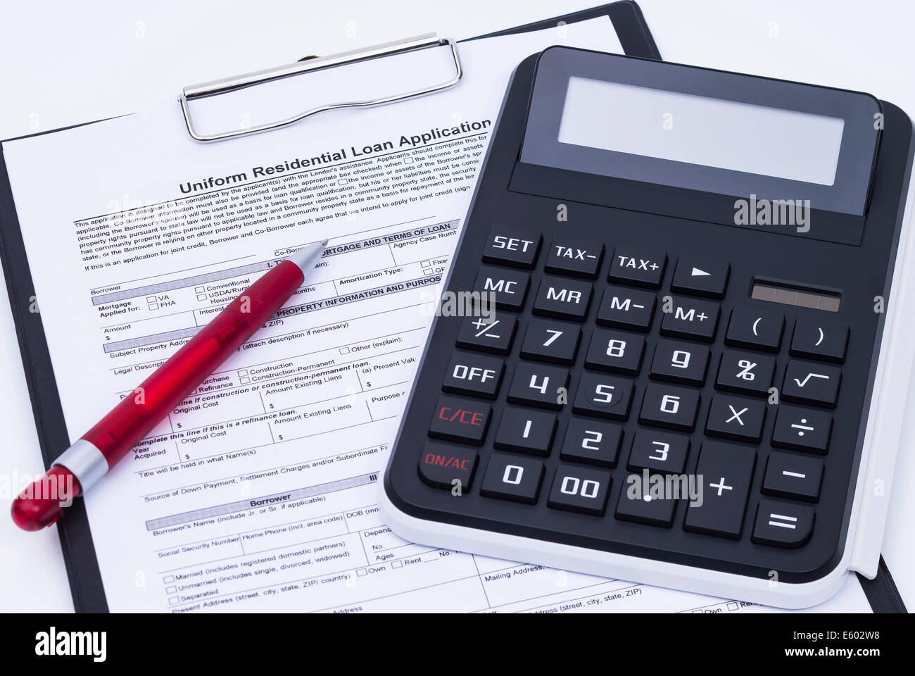 Unfilled loan application form with calculator, pen and notepad Stock Photo