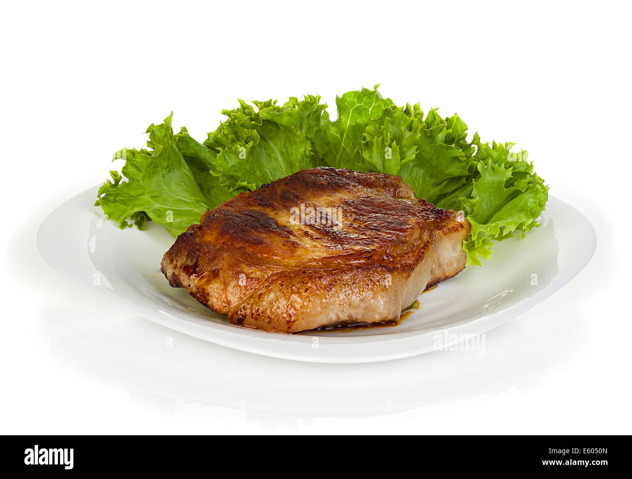 meat steak with lettuce isolated on white background Stock Photo