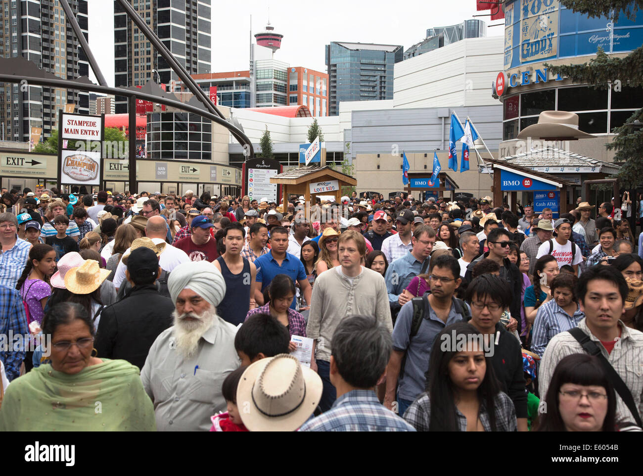 Crowd of people coming through Calgary Stampede main entrance Stock Photo