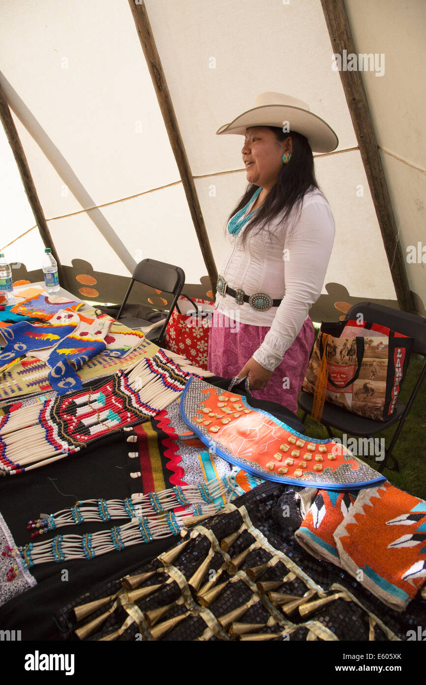 Woman in tipi with educational display of First Nations garments on Canada Day Stock Photo