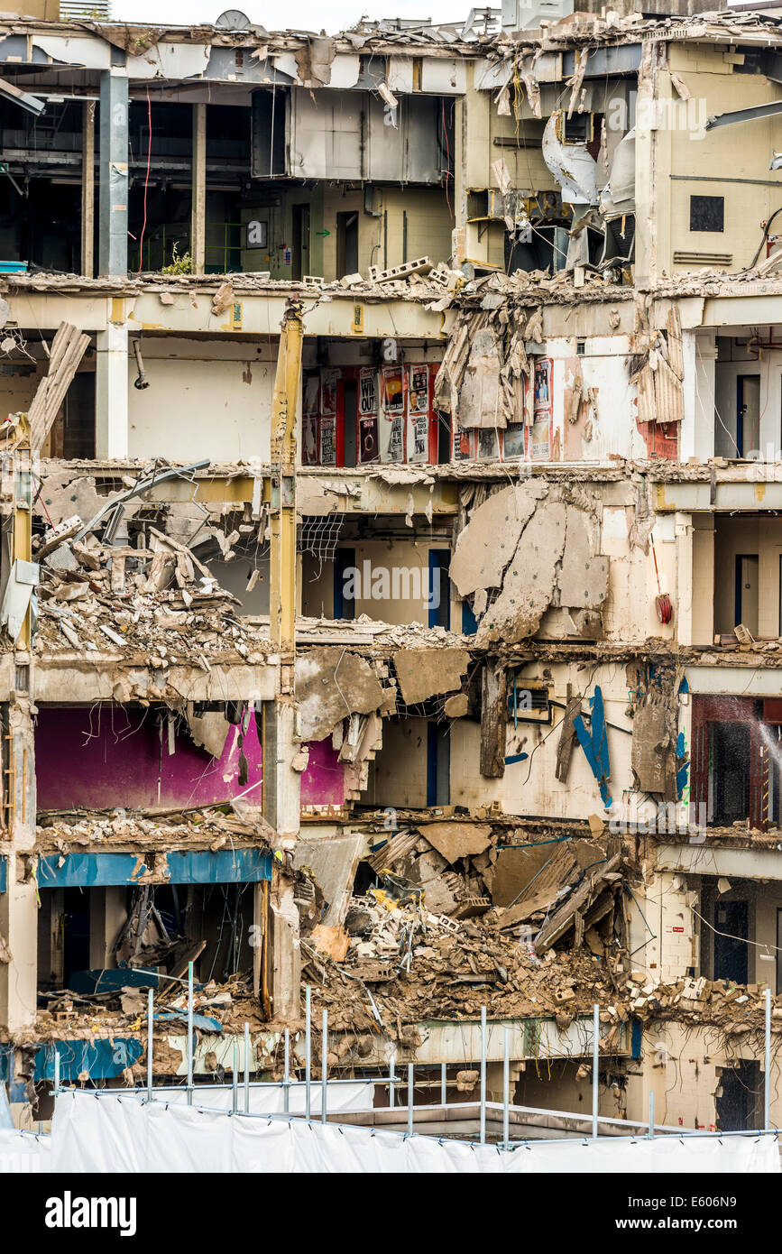 The former Headquarters of News International in Wapping London is knocked down revealing wallpaper with The Sun Headlines on Stock Photo