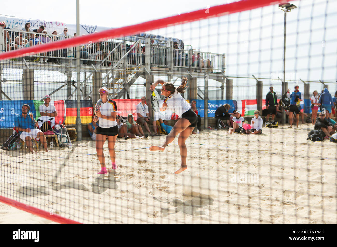 City of Brighton & Hove, East Sussex, UK.European Beach Tennis Championships 2014 Brighton, Yellow Wave, Madeira Drive, Brighton, Sussex, UK. In this image is a women's doubles quarter final between teams from France and Germany in shot. 9th August 2014David Smith/Alamy Live News Stock Photo