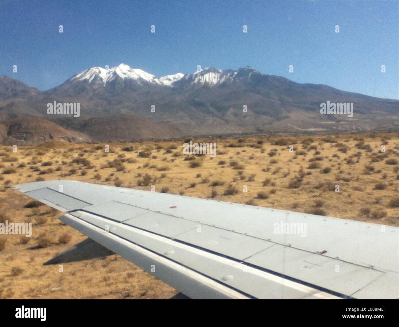 The snow capped peaks of Chachani mountain, as seen from the runway of Arequipa airport, Peru Stock Photo