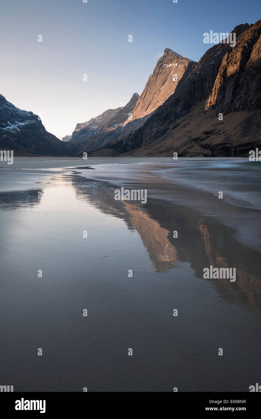 Mountains reflect in water at Horseid beach, Moskenesøy, Lofoten Islands, Norway Stock Photo