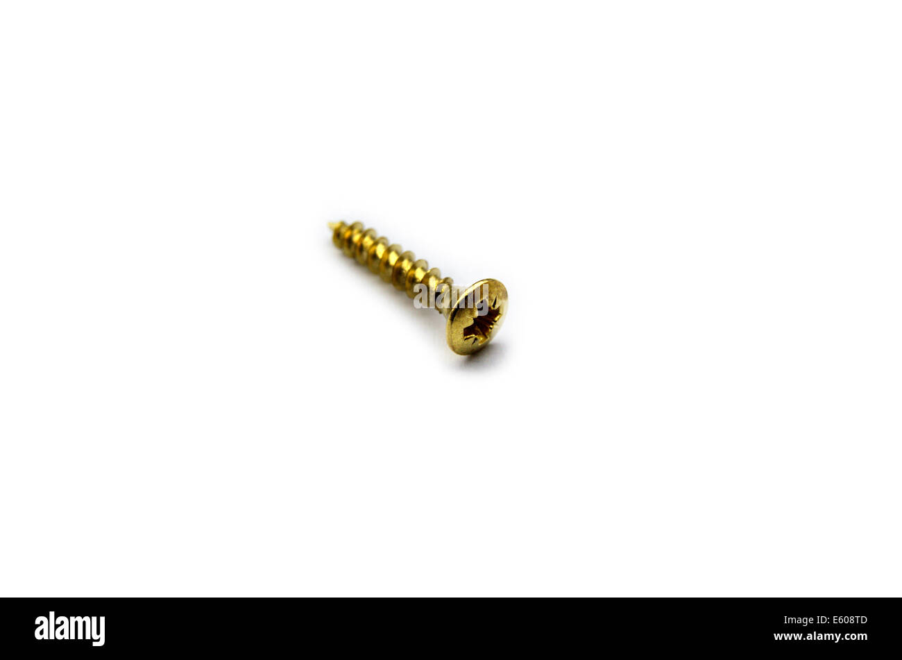Yellow Brass Screw With a Philips Crosshead Isolated On White Stock Photo