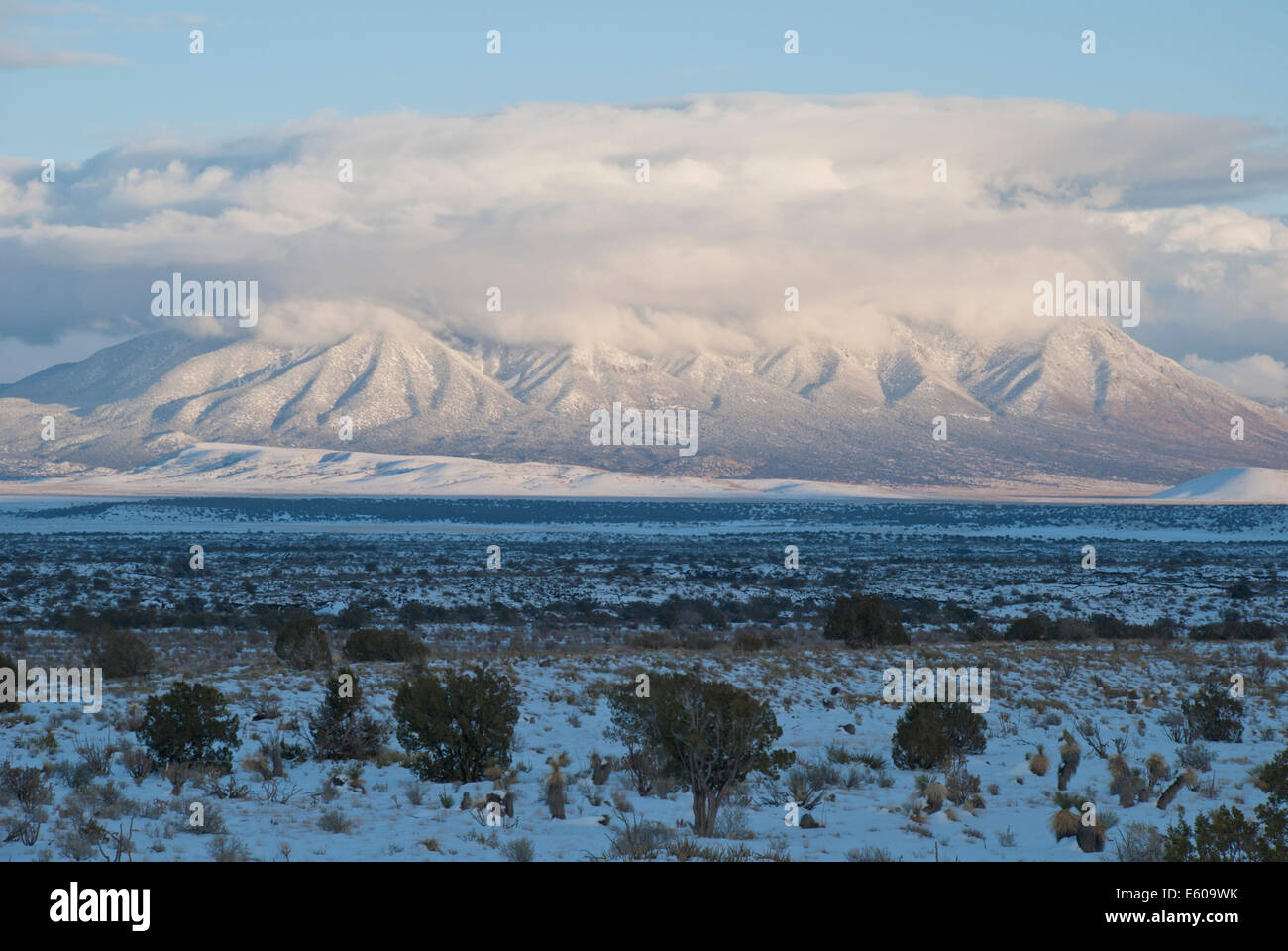 The Carrizo Mountains draped in clouds and covered with snow. Stock Photo