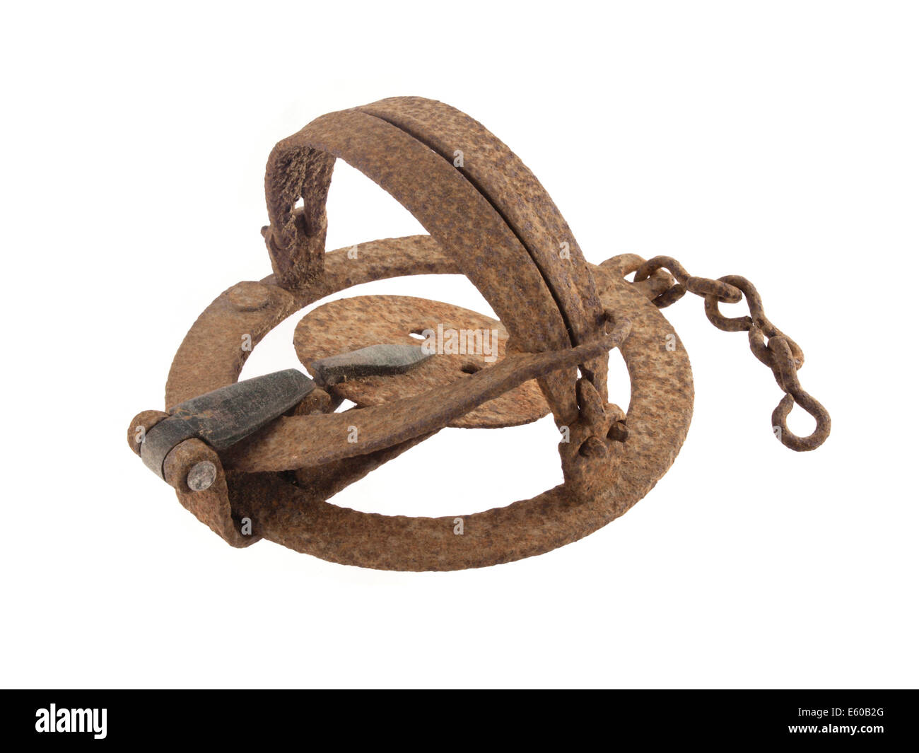 Close up photo of a rusty vermin trap on a white background. Stock Photo