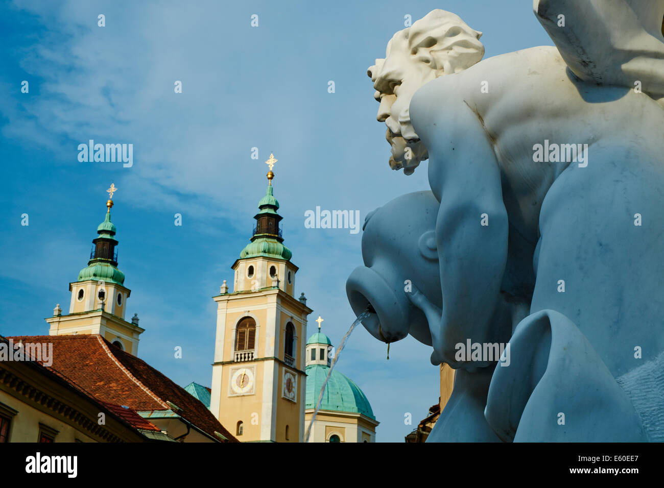 Slovenia, Ljubljana, Robba Fountain and St Nicholas church Stock Photo