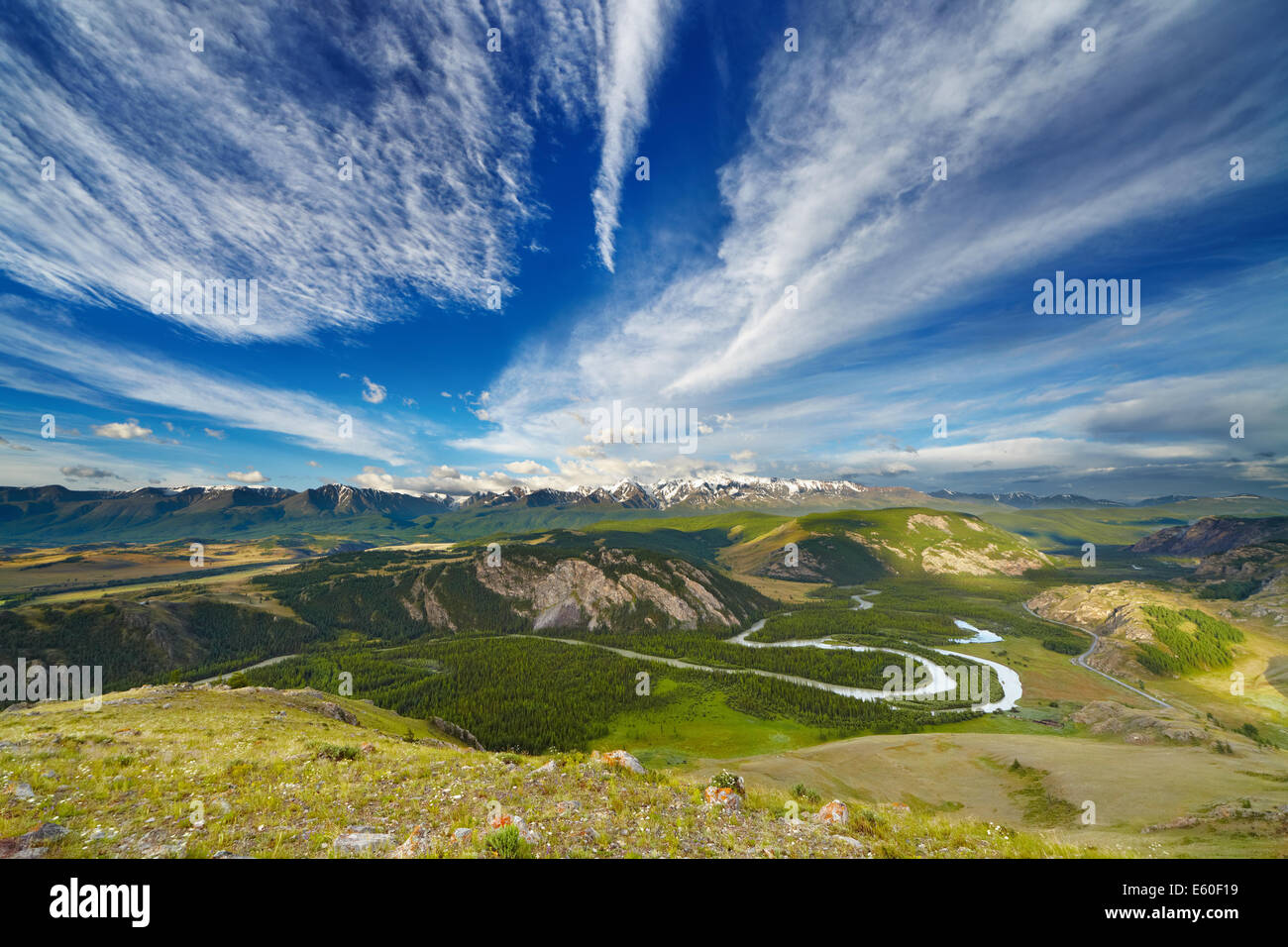 Mountain landscape with river and snowy peaks Stock Photo