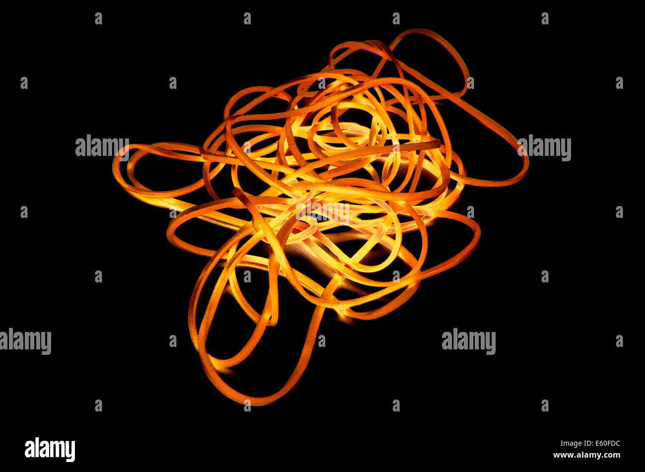 Yellow Rubber Bands Isolated On The Black Background Stock Photo - Alamy