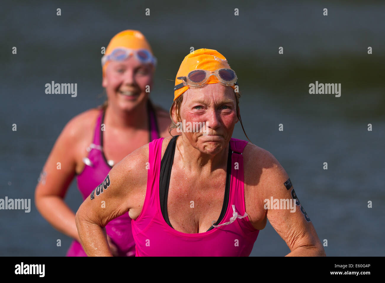 People competing in Ångaloppet, a swimrun competition where you run on land and swim in lakes and the sea several times. Stock Photo
