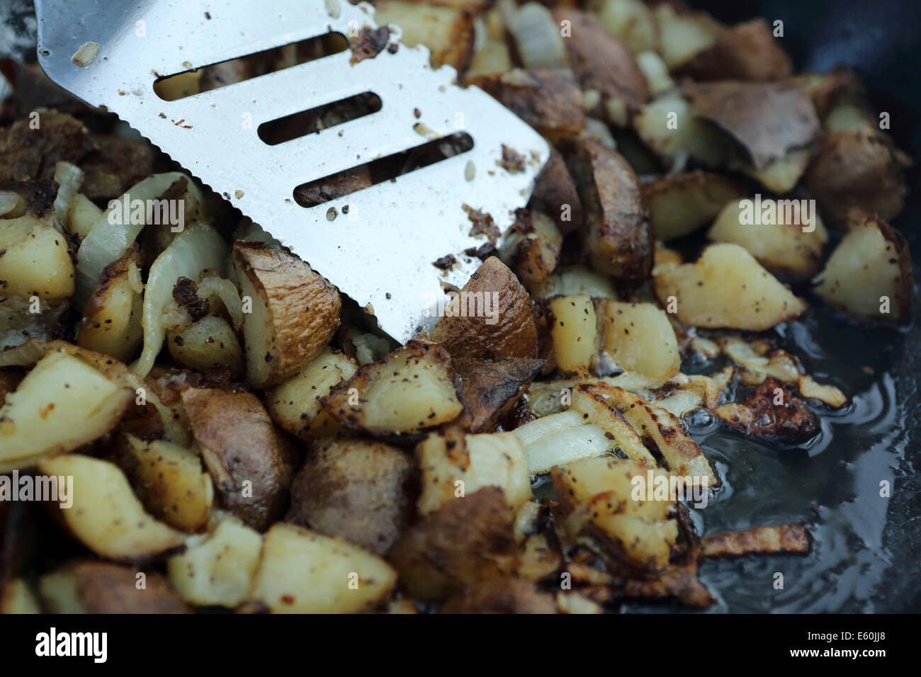 Potatoes cook in a lakeside dinner at Otter Lake near Missinipe, Saskatchewan, Canada. Stock Photo