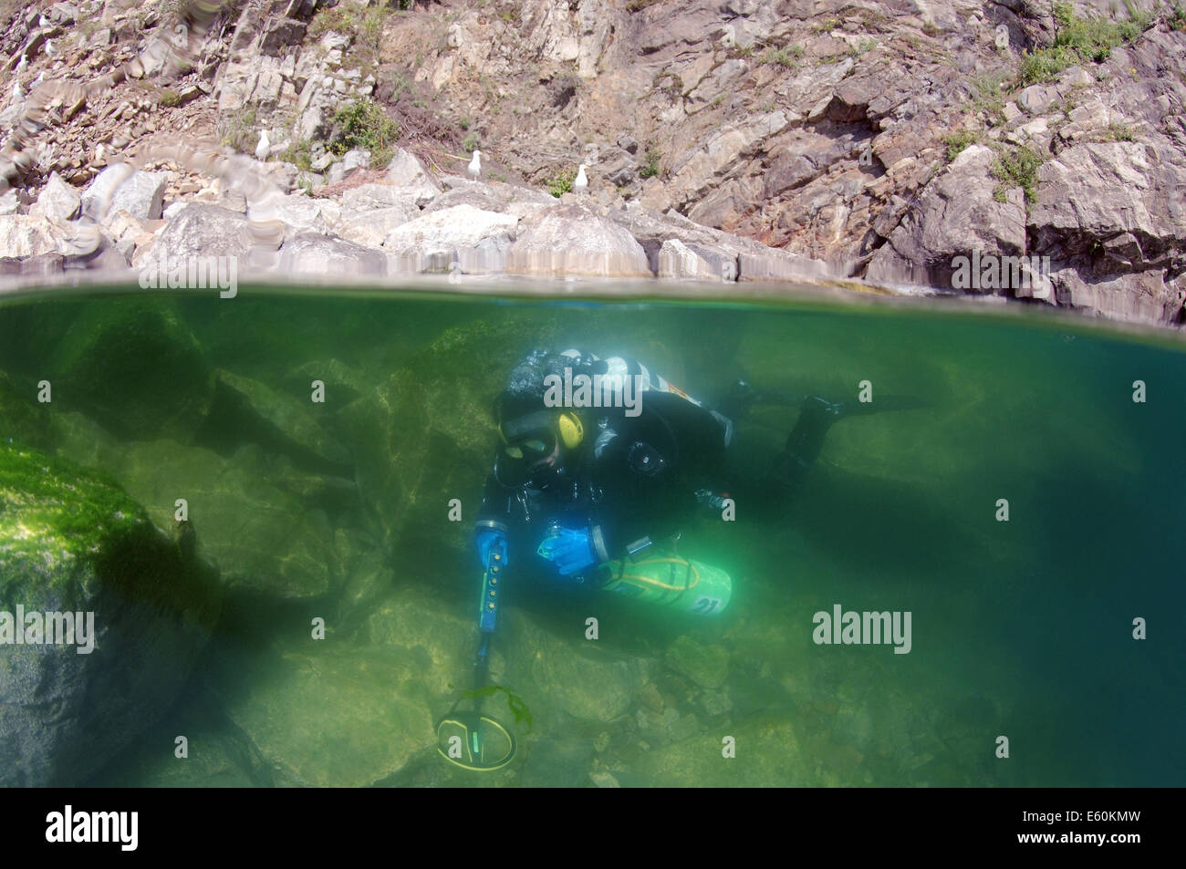 Split level, Diver with the metal detector searching for underwater treasure, lake Baikal, Siberia, Russia, Eurasia Stock Photo