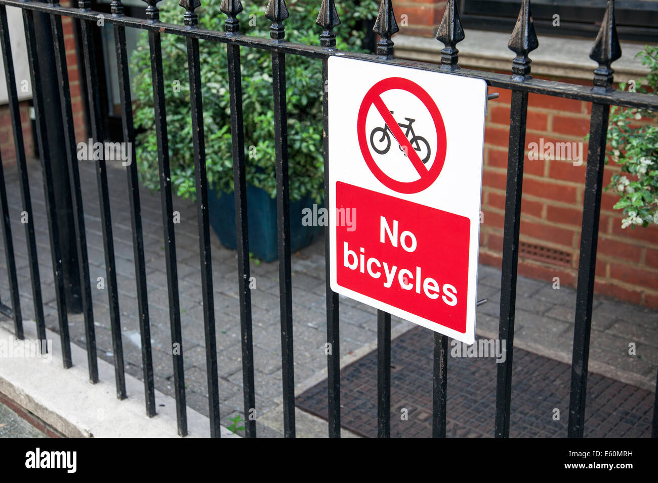 No bicycles sign in North London - preventing bicycles being chained to the railing Stock Photo