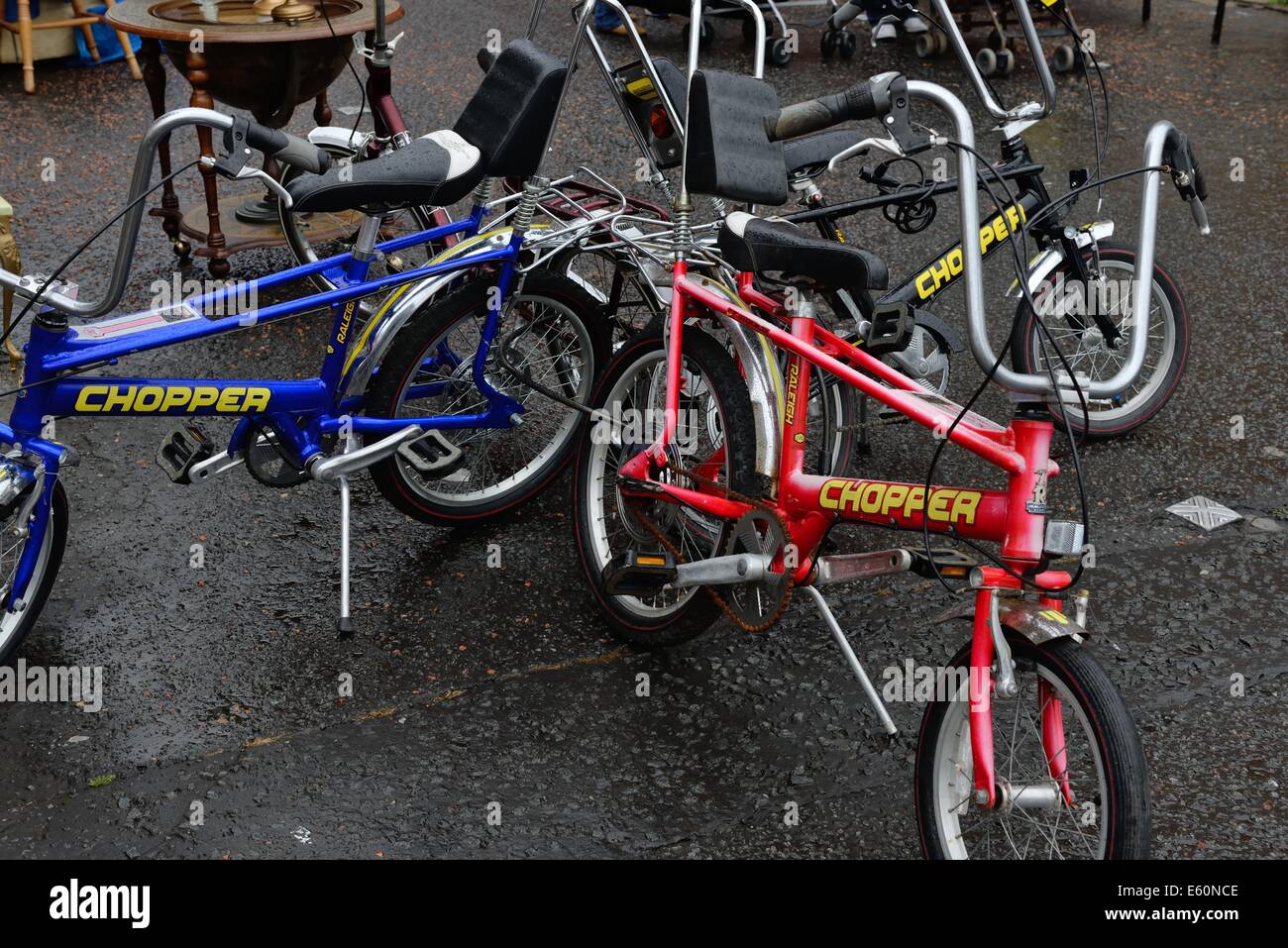 A selection of 70's Raleigh chopper bicycles at a flea market in Glasgow Stock Photo
