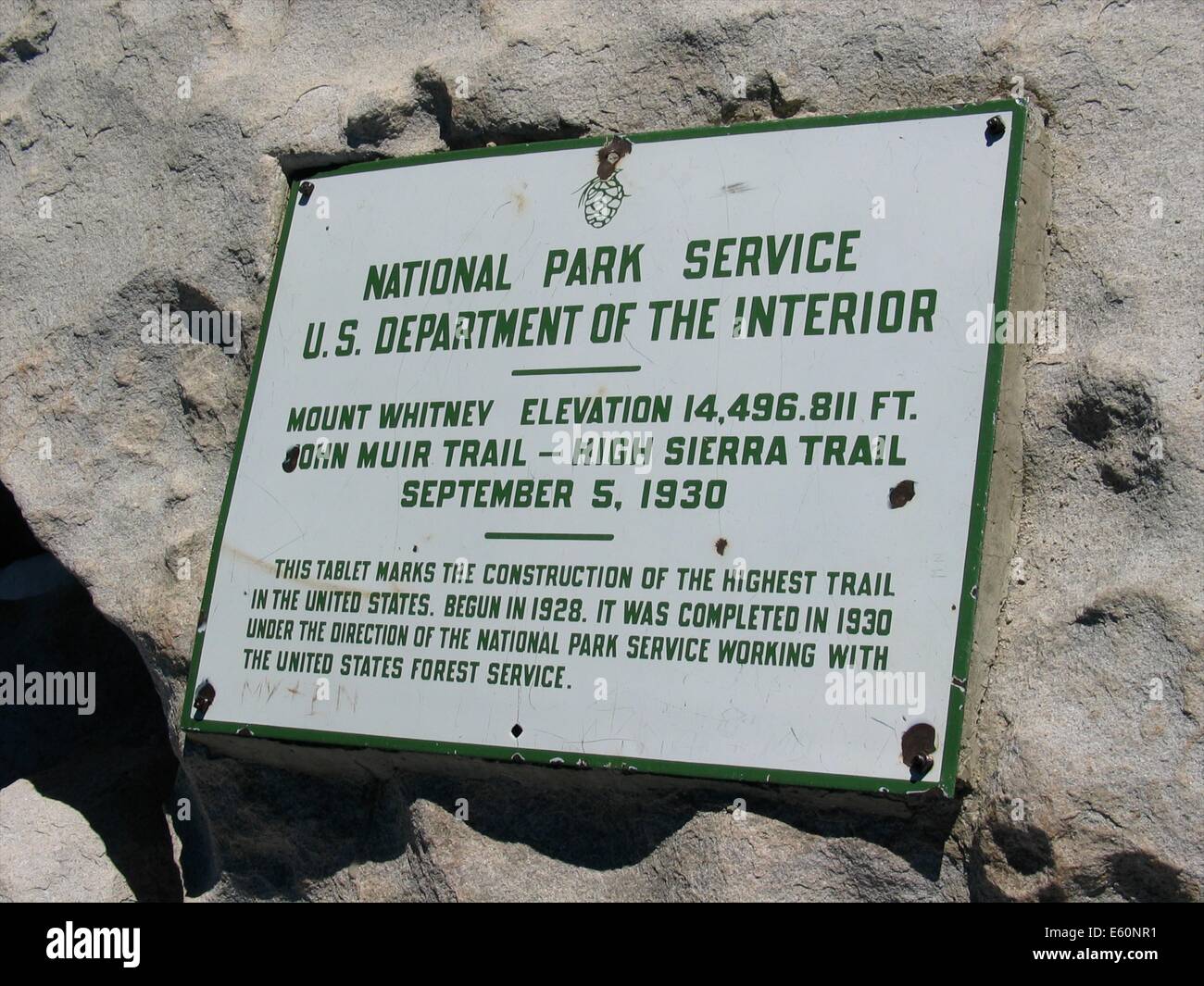 A plaque from the National park service marking the summit of Mount Whitney (14,496ft). California, USA Stock Photo