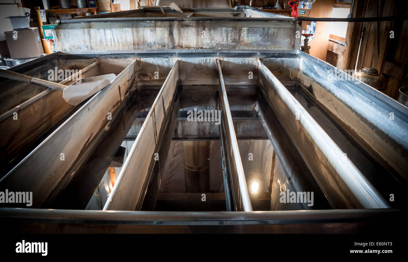 Maple syrup in traditional evaporator Stock Photo Alamy
