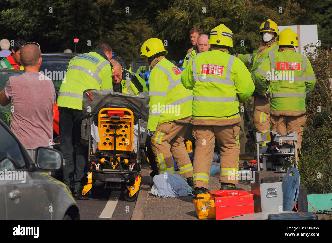 Bexhill, East Sussex, UK.10th August 2014. Emergency Services in action after a Road Traffic accident on the A259 , Barnhorn Road, West of Little Common. A lady was taken from the scene by road ambulance Police advised her injuries were not serious, helicopter evacuation was not required by Kent HEMS which was quickly on site. Locals at the scene advise that this is a regular accident Black spot.. David Burr/Alamy Live News Stock Photo