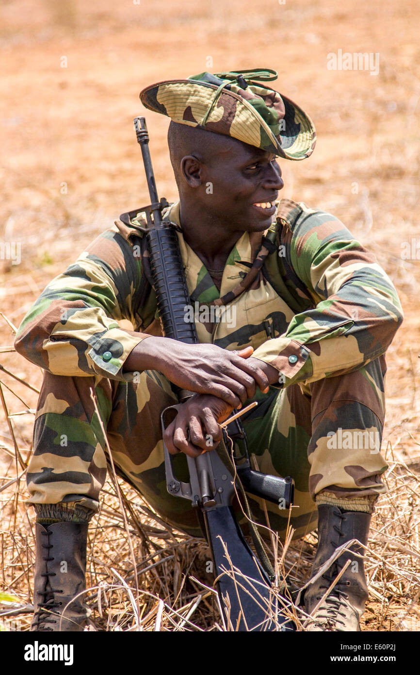 A Senegalese soldier takes a break after crowd control training conducted by U.S. Marines during Western Accord 14 June 17, 2014 in Thies, Senegal. Stock Photo