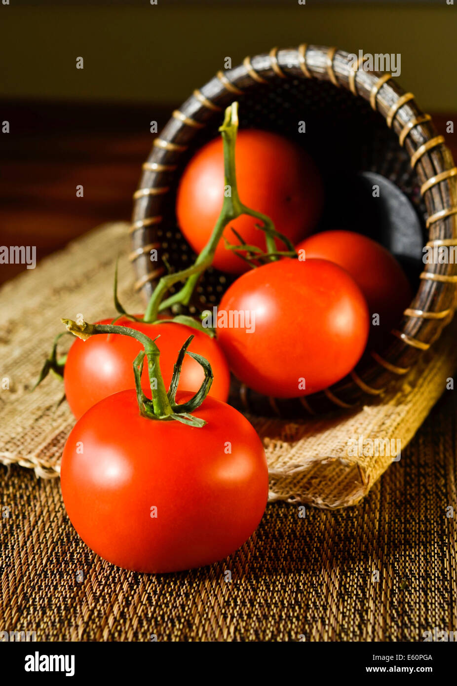 Fresh tomatoes in a basket Stock Photo