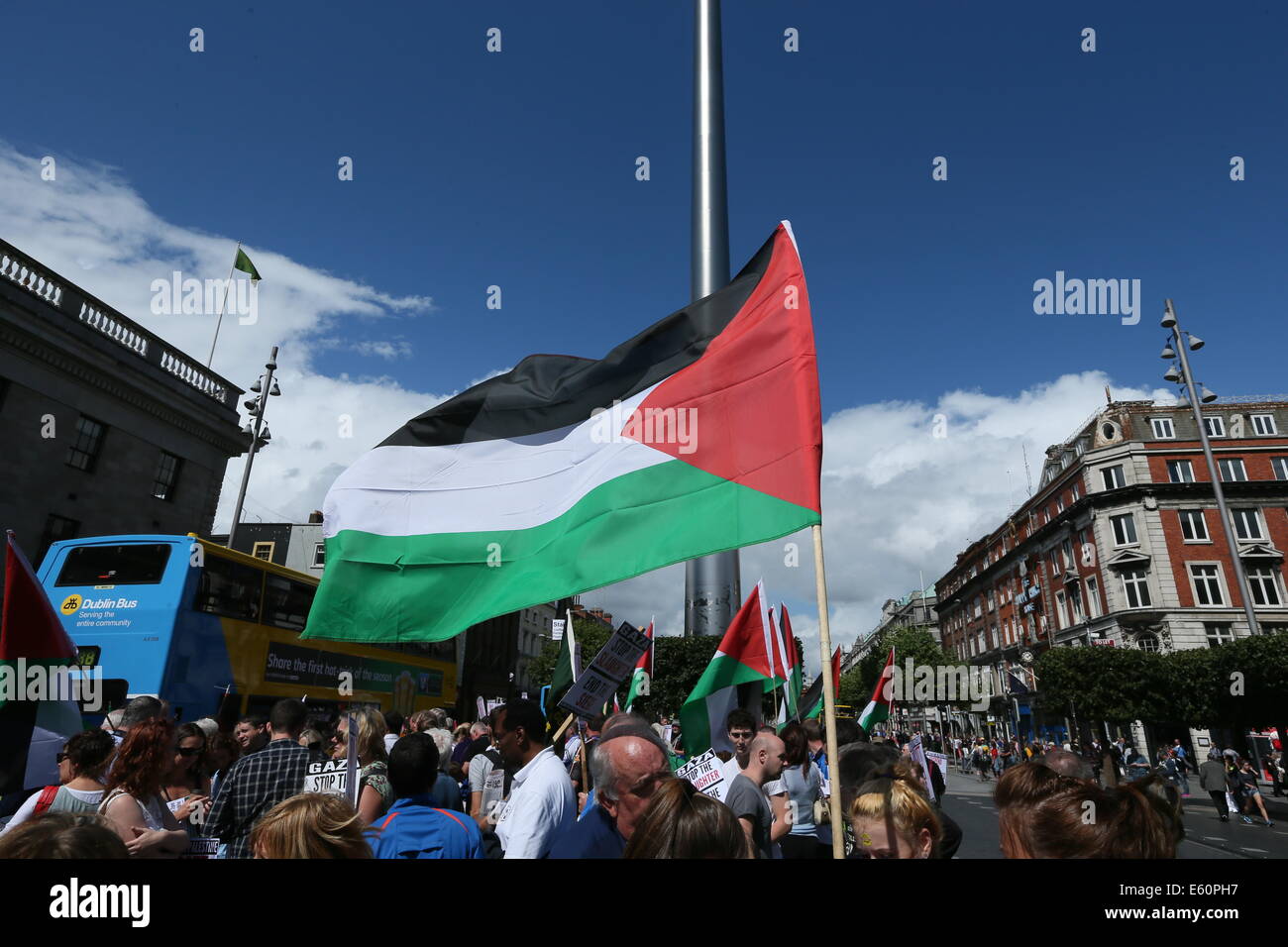 A Palestinian flag flies at an O'Connell Street rally in Dublin city centre in solidarity with the people of Gaza, Palestine. Stock Photo