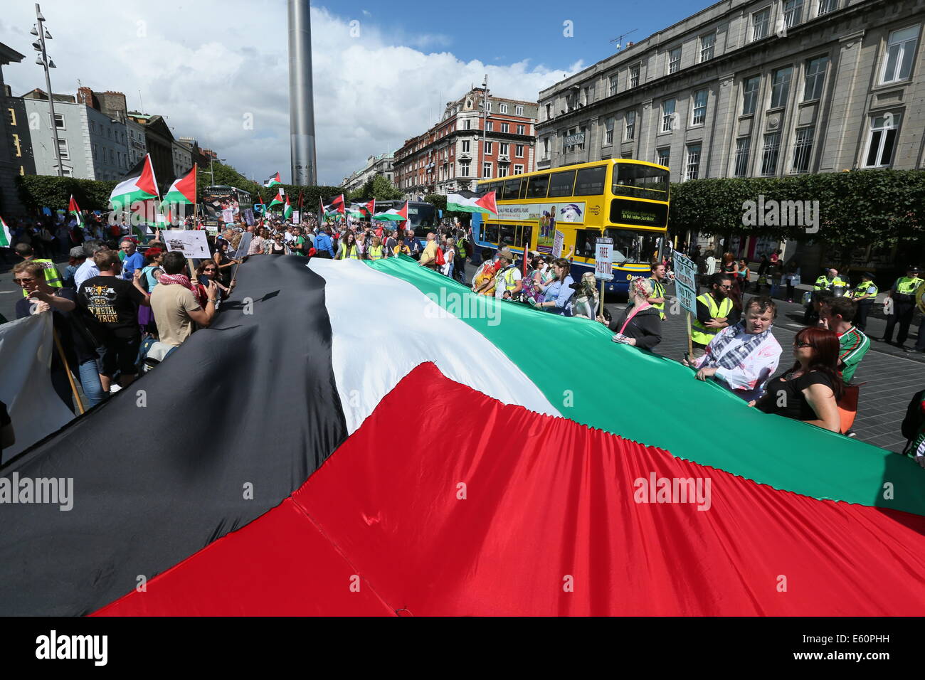 A large Palestinian flag is held up during the rally in Dublin city centre in solidarity with the people of Gaza, Palestine. Stock Photo