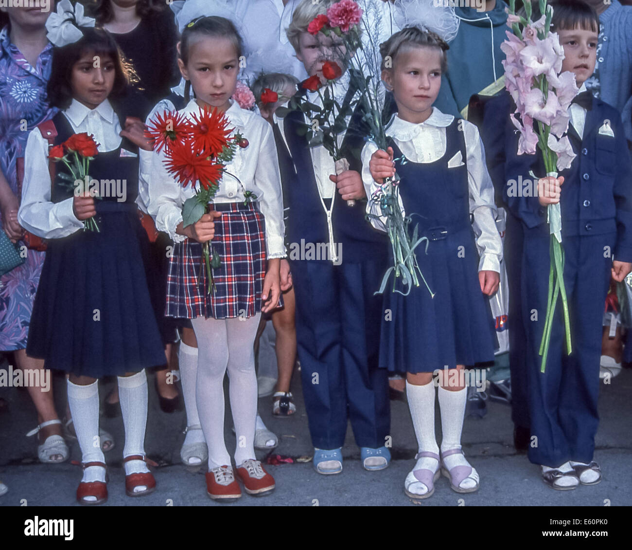 June 10, 1998 - Tallinn, Estonia - Young boys and girls hold flowers ...