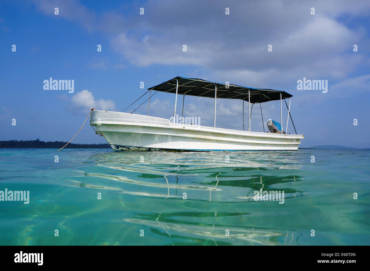 typical Panga boat viewed from the water surface in the Caribbean sea, Central America Stock Photo