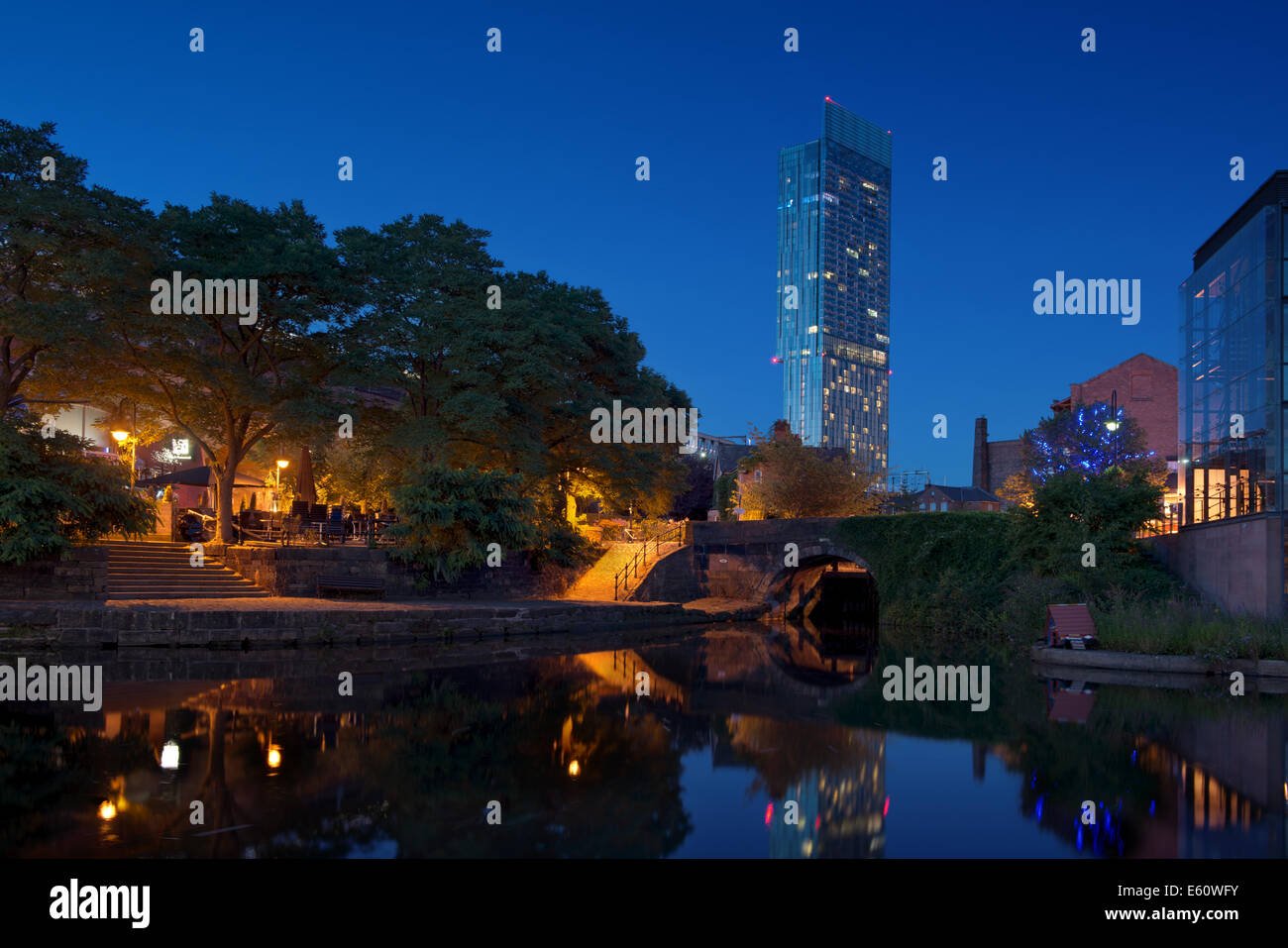 The Castlefield Urban Heritage Park and historic inner city canal conservation area with Beetham Tower in Manchester at night. Stock Photo