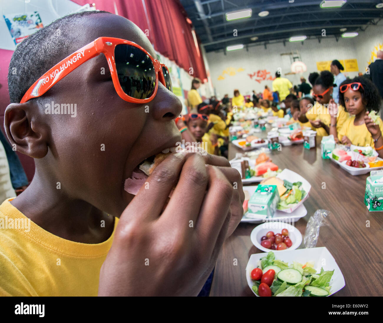 Students at Hamilton Elementary Middle School enjoy the Summer Food Service Program providing healthy meals in the summer months Stock Photo
