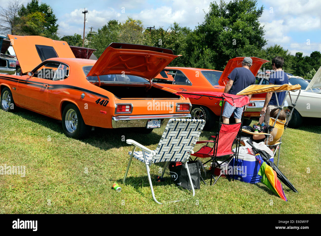 American vintage car show in Salisbury, North Carolina. Family picnic behind a1973 Plymouth Duster. Stock Photo