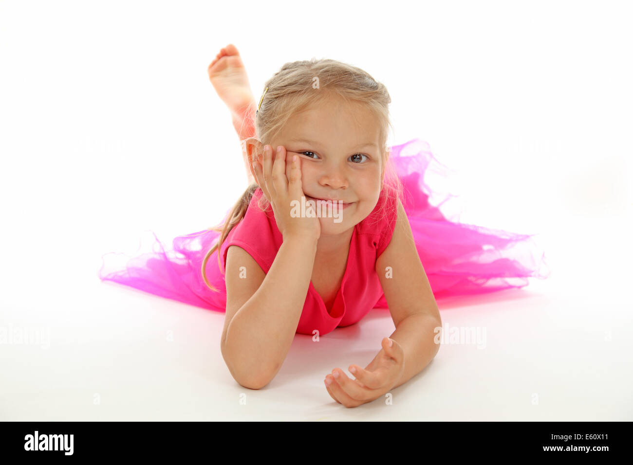 Cute girl in ballerina dress on white background Stock Photo