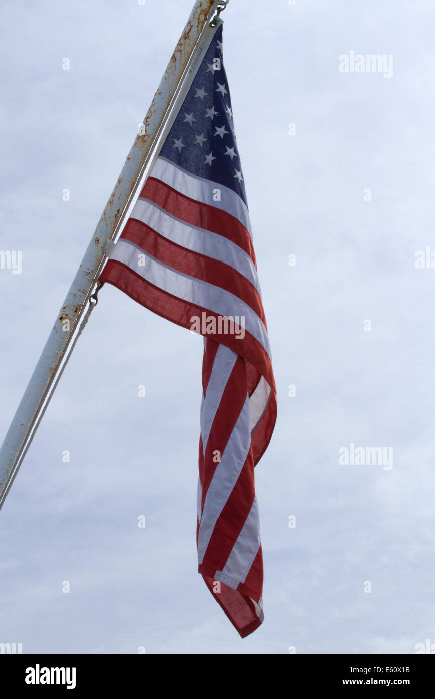 American Flag hanging on a mast Stock Photo