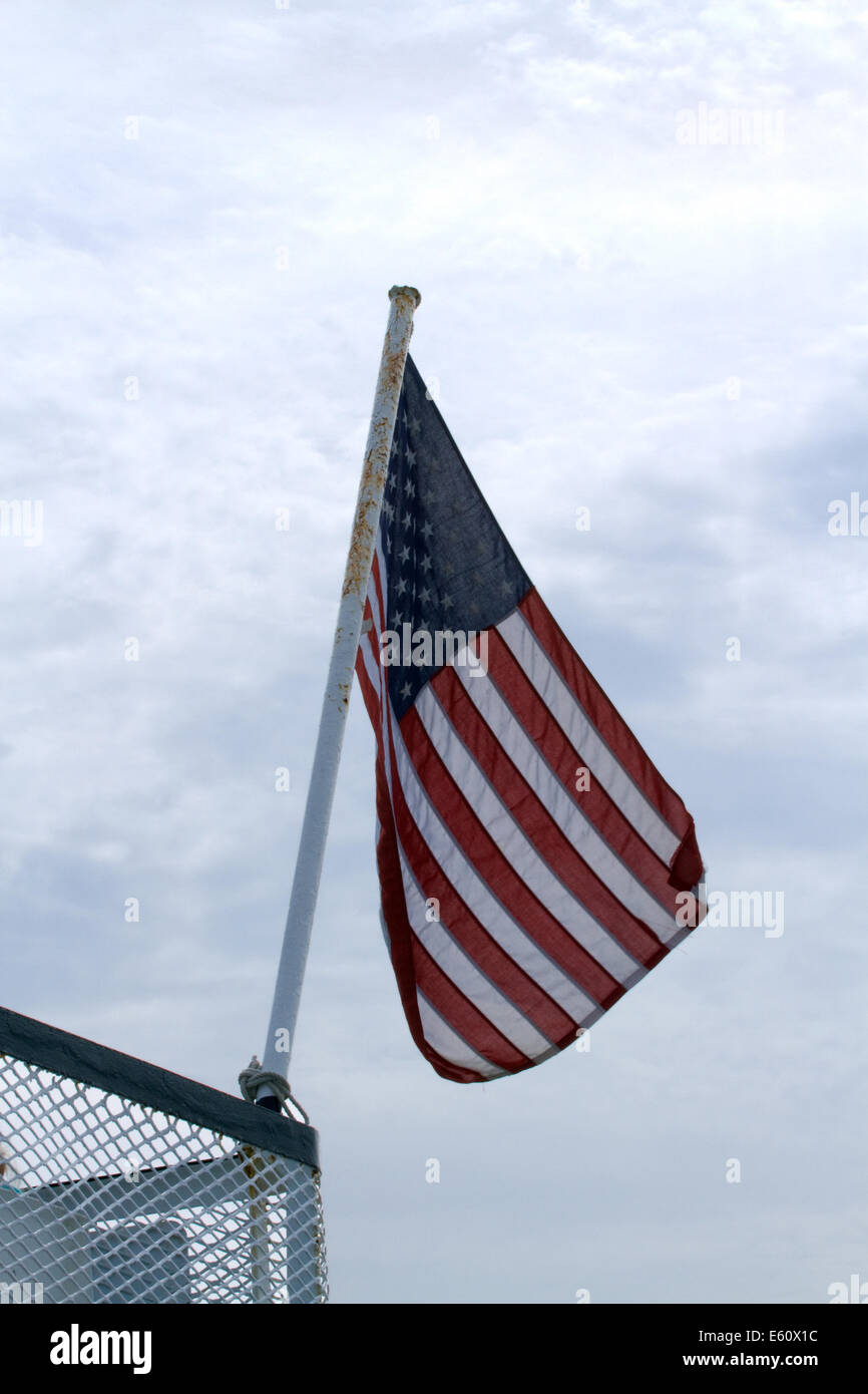 American Flag blowing in the wind Stock Photo