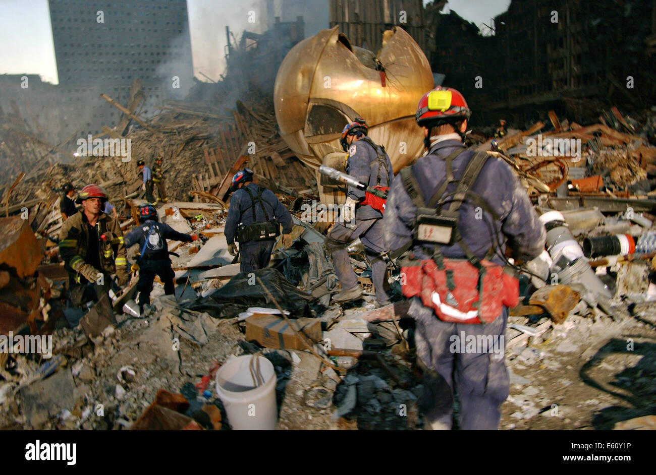 Rescue workers continue the recovery of victims amongst the wreckage of the World Trade Center in the aftermath of a massive terrorist attack which destroyed the twin towers killing 2,606 people September 16, 2001 in New York, NY. Stock Photo