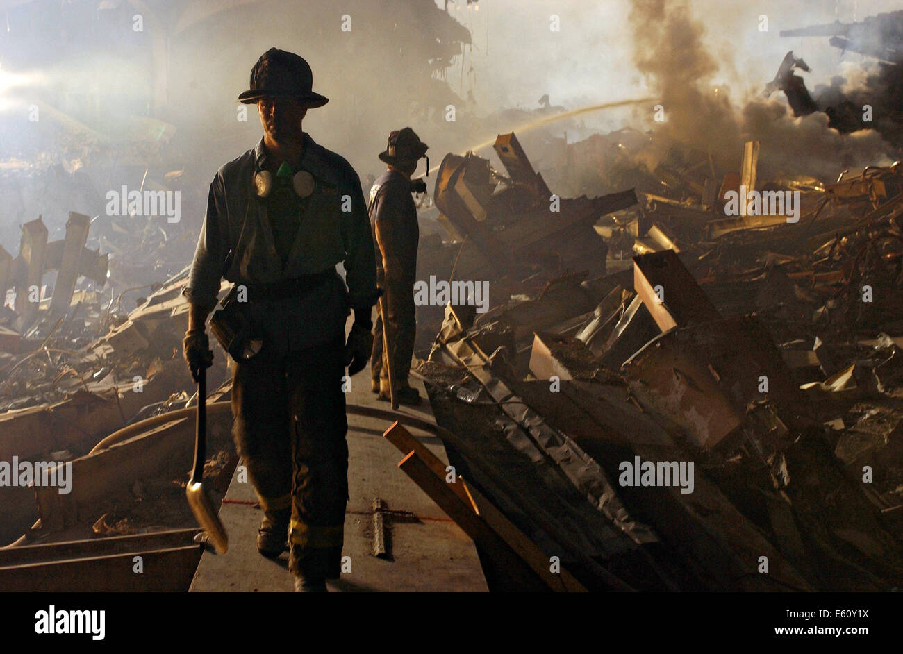 Firemen continue to battle fires as work continue amongst the wreckage of the World Trade Center in the aftermath of a massive terrorist attack which destroyed the twin towers killing 2,606 people September 19, 2001 in New York, NY. Stock Photo