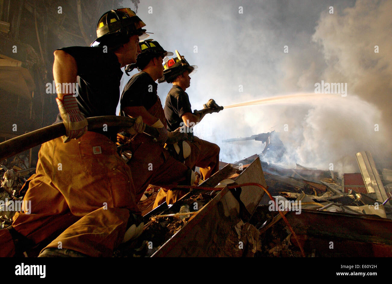 Firemen continue to fight blazes amongst the wreckage of the World Trade Center in the aftermath of a massive terrorist attack which destroyed the twin towers killing 2,606 people September 20, 2001 in New York, NY. Stock Photo