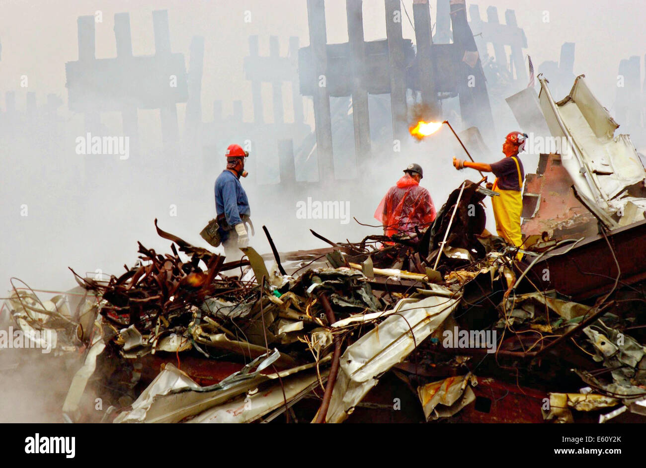 Rescue workers continue to remove debris cutting through massive steel beams amongst the wreckage of the World Trade Center in the aftermath of a massive terrorist attack which destroyed the twin towers killing 2,606 people September 20, 2001 in New York, NY. Stock Photo