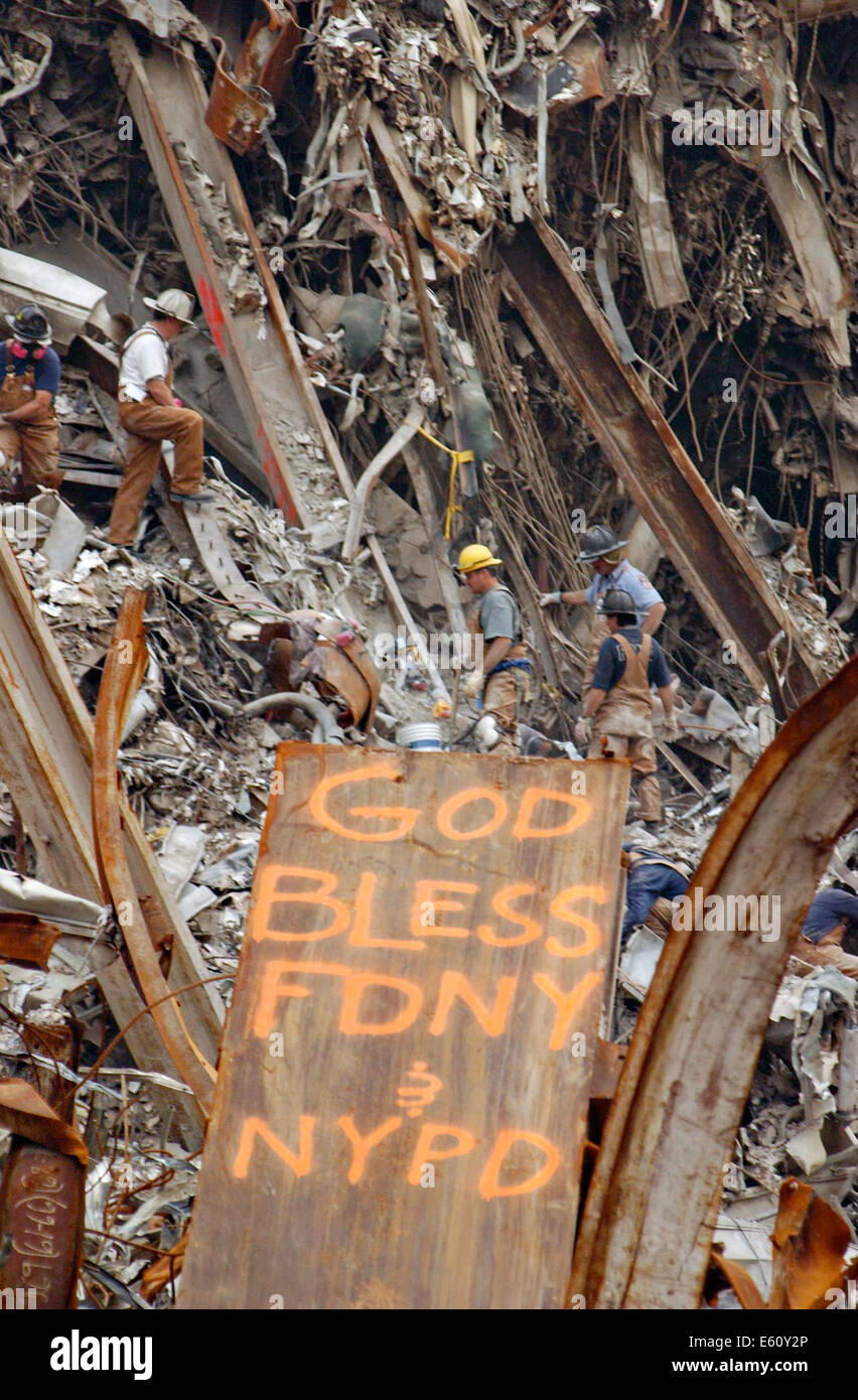 Rescue workers clear rubble amongst the wreckage of the World Trade Center in the aftermath of a massive terrorist attack which destroyed the twin towers killing 2,606 people September 21, 2001 in New York, NY. Stock Photo