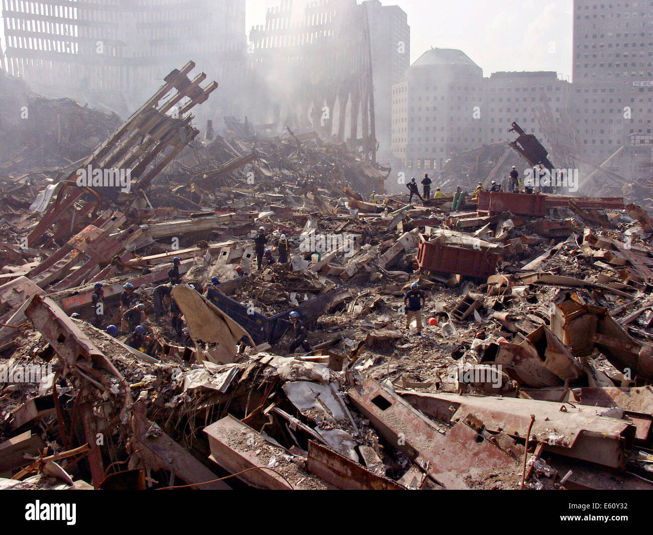 Urban search and rescue teams look through the rubble for victims amongst the wreckage of the World Trade Center in the aftermath of a massive terrorist attack which destroyed the twin towers killing 2,606 people September 21, 2001 in New York, NY. Stock Photo