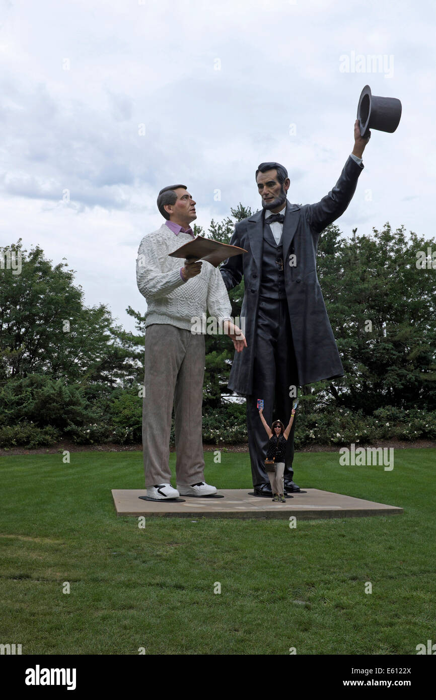 Asian Woman standing in front of Return Visit - Sculpture of Abraham Lincoln with a man from  present - NJ Grounds for Sculpture Stock Photo