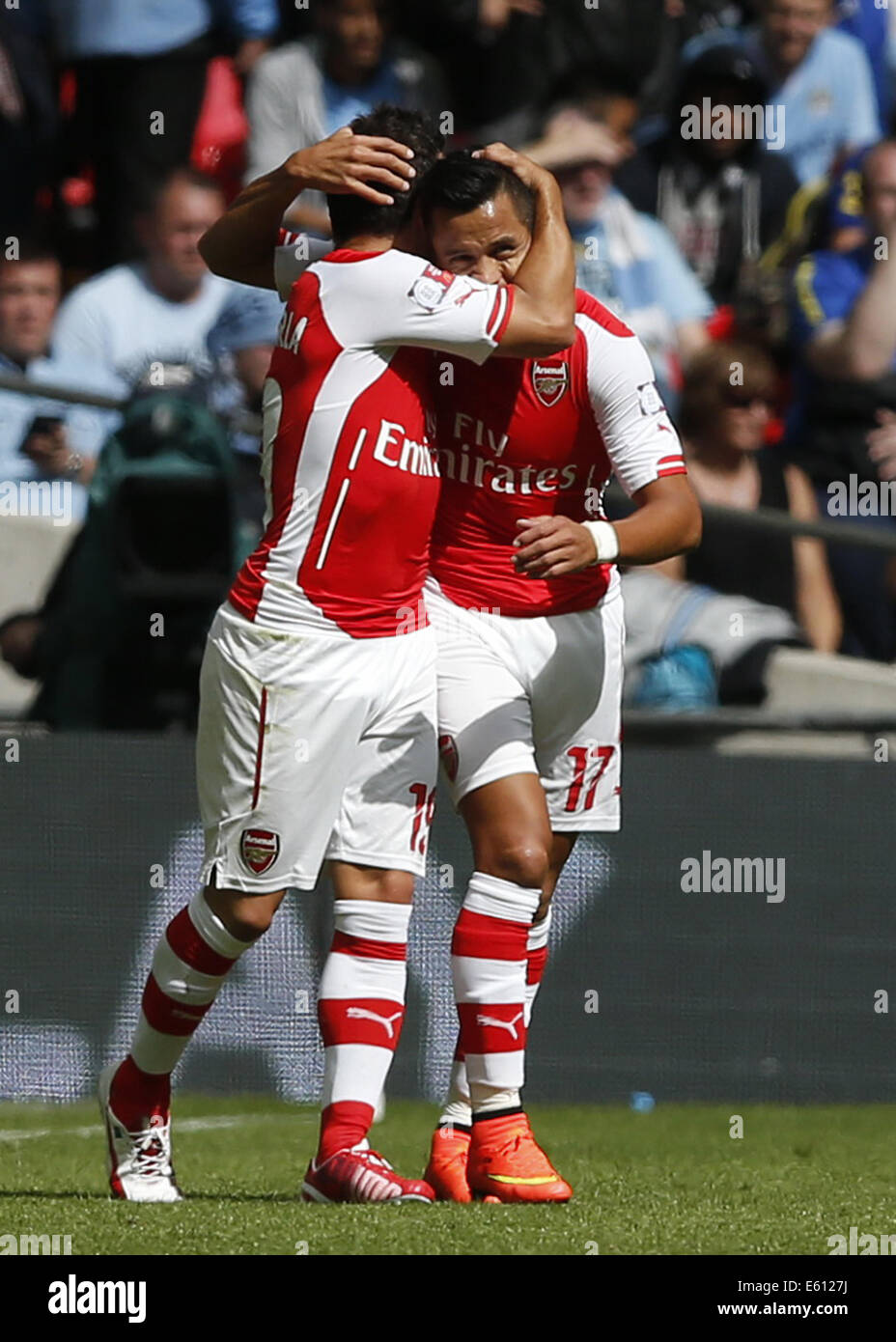 London, UK. 10th Aug, 2014. Santi Cazorla (L) of Arsenal celebrates scoring with teammate Alexis Sanchez during the Community Shield match between Arsenal and Manchester City at Wembley Stadium in London, Britain on Aug. 10, 2014. Arsenal won 3-0. Credit:  Wang Lili/Xinhua/Alamy Live News Stock Photo