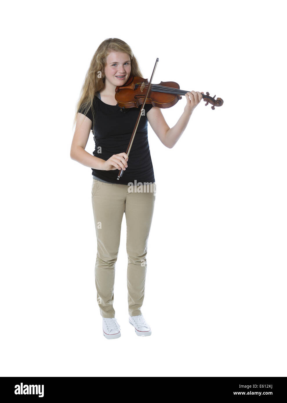 Full body front view of a pretty young teenage girl playing violin isolated on white Stock Photo